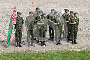 Platoon of soldiers of the Belarusian army with the flag of the Belarusian republic