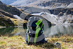 PLATTACHSEE , AUSTRIA 20 September , 2020  Deuter hiking backpack in front of the mountain lake `Plattachsee` when the weather is