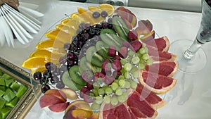 Platter of assorted fresh fruit at buffet table