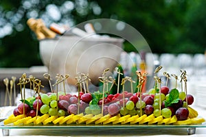 Platter of assorted fresh fruit at buffet table