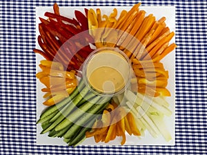 Platter of assorted fresh vegetables with dip