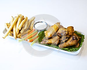 Platter of chicken wings and french fries