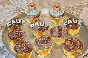 Platter of chocolate cupcakes with bears