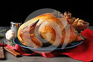 Platter of cooked turkey with rosemary served photo