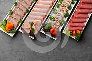 Platter of fresh meat cold cuts on table