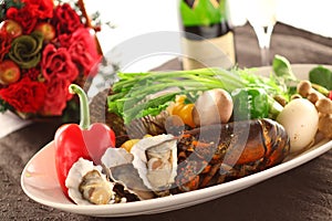 Platter of fresh seafood with oyster, lobster, clams, chili, mus