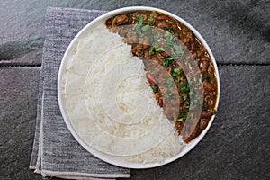 A platter of Indian red Kidney beans curry or Rajma Masala and rice