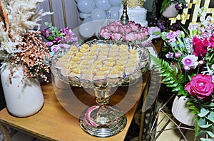 Platter with milk sweets composing the table decoration for the birthday