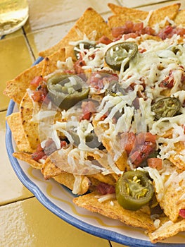 Platter of Nachos with Salsa Jalapenos and Cheese