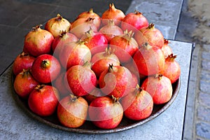 Platter pomegranate fruit for sale at a farmers market