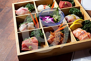 platter of sashimi pieces, sushi, box, platter, sampler