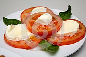 Platter with tomatoes and cheese photo