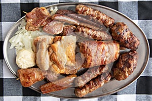 Traditional Serbian mix of the grilled meat - Mesano meso Leskovacki voz photo