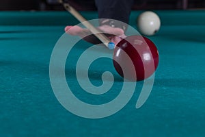 Play billiards. cue and billiard balls. hammer the ball into the hole