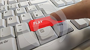 Play button on a computer keyboard. photo