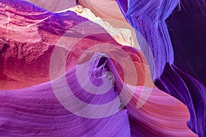 Play of colors and shapes layered fire waves in a sandy labyrinth in Lower Antelope Canyon in Page Arizona