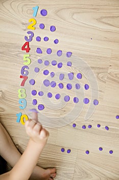 Play-Doh stones and numbers. Counting DIY game.