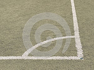 Play field corner, green grass texture of football or soccer field. Marked corner
