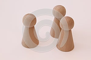 Play figures of wood on white background