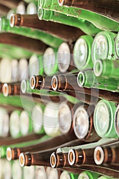 Play of light, reflection and transparency on a wall of bottles