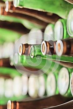 Play of light, reflection and transparency on a wall of bottles