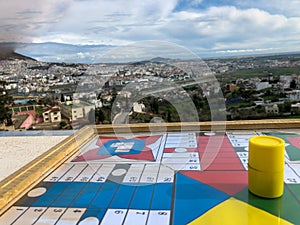Play Parchis on a landscape scene photo