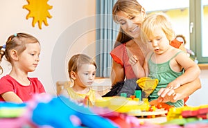 Play school teacher with her students