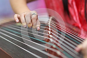 Play traditional Chinese music instrument