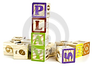 Play word in wooden block letters