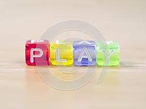 PLAY word written on color block. PLAY text o.n table, concept