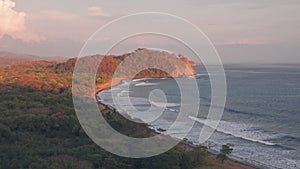 Playa Buena Vista Beach and rainforest at sunset, Guanacaste Province, Costa Rica. Aerial drone vie