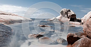 Playa con agua efecto seda entre rocas blancas photo