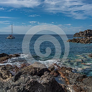 Playa de Abama with a boat and a tourist snorkeling Tenerife, Canary Islands