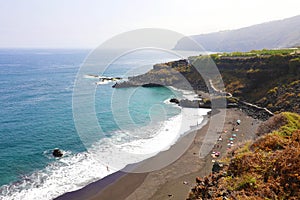 Playa de el Bollullo black volcanic sand beach in Tenerife, Canary Islands, Spain