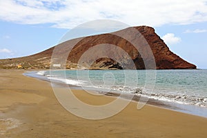 Playa de la Tejita beach with Montana Roja Red Mountain in Tenerife, Canary Islands photo