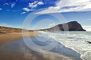 Playa de la Tejita. Kite surfers on Tenerife ocean beach. Tenerife Canary islands, Spain photo