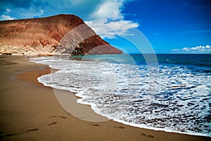 Playa de la Tejita with red mountain Montana Roja photo