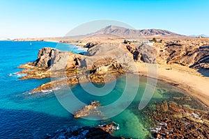 Playa de Papagayo Beach, desert landscape and blue sky. Lanzarote