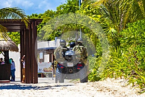 Police military National Guard patrols monitors beach Playa del Carmen Mexico