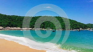 Playa El Maguey. Huatulco, Oaxaca, Mexico. A slow pan from beach to ocean.