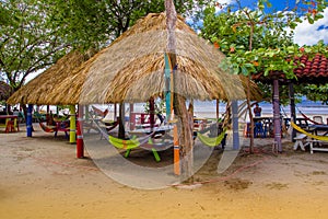 Playa hermosa, Mexico, May, 29, 2018: Outdoor view of hammocks inside of hut structures made of straw, in a caribbean