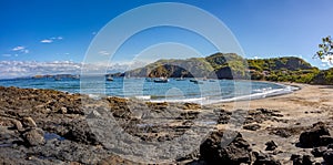 Playa Ocotal and Pacific ocean waves on rocky shore, El Coco Costa Rica