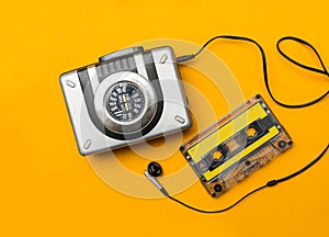 Player and audio cassete on yellow