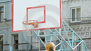 Player dribbling ball from center of field, putting it in basket and missing