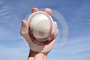 Player Gripping a New Baseball photo