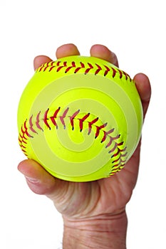 Player Gripping a Yellow Softball photo
