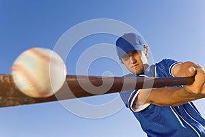 Player Hitting Ball With Baseball Bat