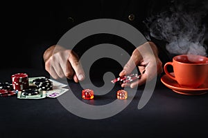 A player places a bet with chips on a winning combination when playing craps in a poker club. Luck or fortune in the casino