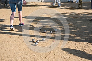 Player playing boules during a tournament