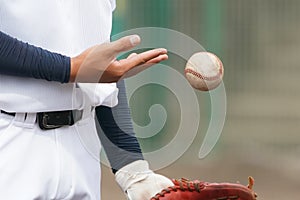 A player`s hand throwing a ball